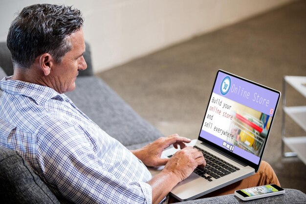 An individual looks at a laptop screen displaying the Social Security Administration website, focusing on the application section. The person appears determined and focused, suggesting the effort required to navigate the application process.