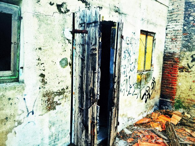 A photo depicting a dilapidated community center with graffiti on the walls, symbolizing the decay of social structures in areas heavily affected by mass incarceration.