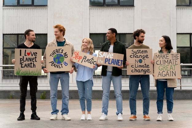 A diverse group of people holding signs advocating for climate action, with the US Capitol Building in the background. The signs display messages about renewable energy, clean air, and a sustainable future.
