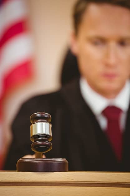 A gavel resting on a copy of the United States Constitution in a courtroom setting, symbolizing legal decisions related to voting rights.