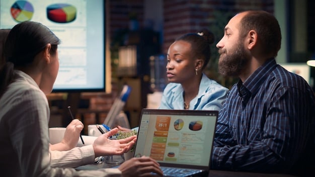 A team of diverse professionals collaborating in a modern office space, working on laptops and interactive displays, with a focus on data analysis and strategic planning.