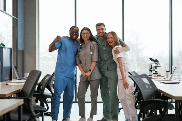 A photo of a diverse group of healthcare workers smiling at camera, in a modern workspace