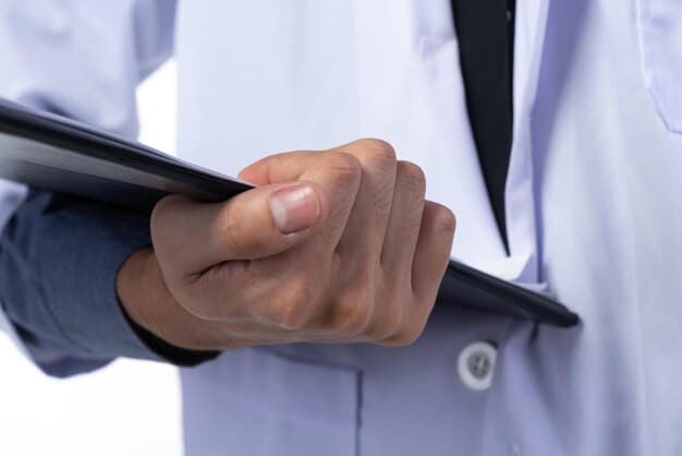 A close-up of a doctor's hand reviewing medical charts, symbolizing changes in medical evidence requirements for disability claims.